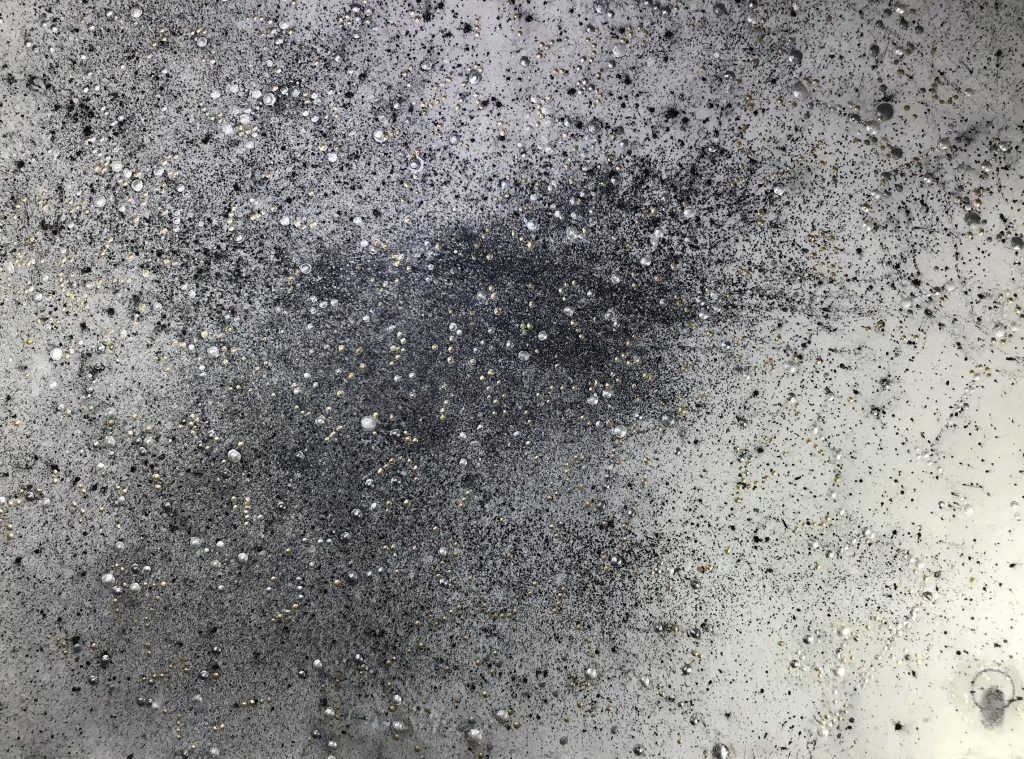 Bobbie Moline-Kramer, 11-04-1946, Fort Madison, Iowa, Self-Portrait, 2020. blown graphite dust, oil and metallic acrylic on handmade Japanese paper on wood. 18 x24 inches