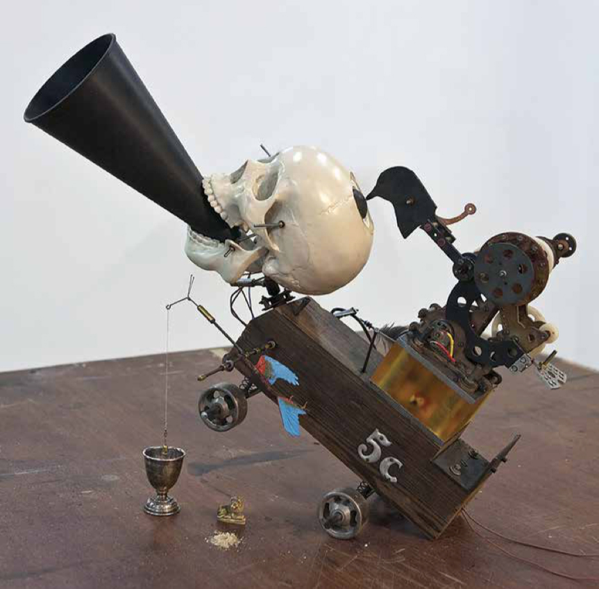 Jinsu Han, Dream Fiend 5C, 2009. Plastic model, steel, wood, epoxy resin, ABS plastic, copper, silver cup, speaker, radio receiver, motor, feather, steel wheel and chalk powder, 30.7 x 25.6 x 19.6 in. Courtesy of Marc Straus Gallery.