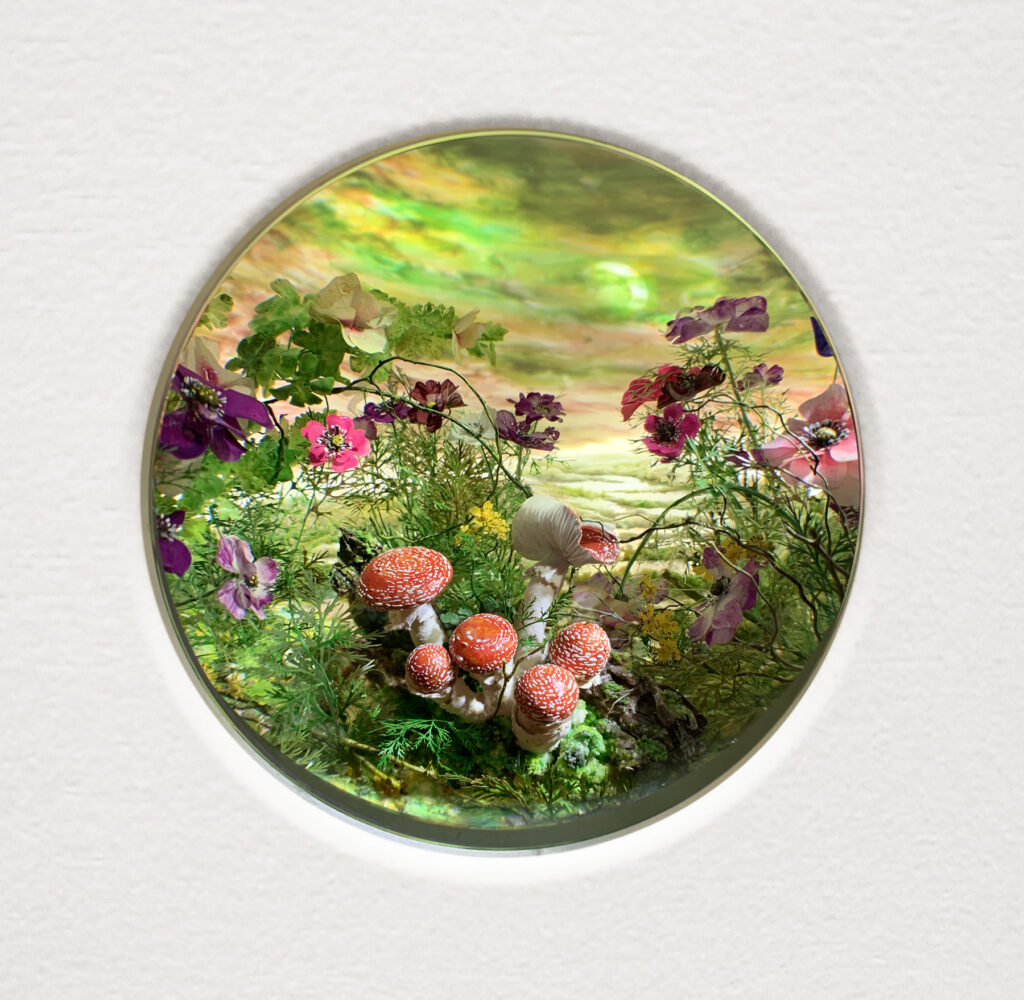 Patrick Jacobs, Fly Agarics with Eclipse, 2021, diorama viewed through 2 in. (5 cm) window, Styrene, clay, paper, foam, wood, acrylic, steel, lighting, BK7 glass, 11 1/4” (H) x 14 3/4” (W) x 9 1/4” (D)