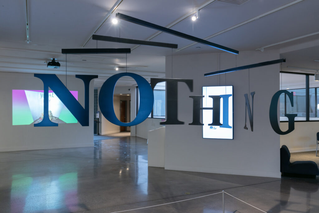 Foreground: Joel Swanson, NO/NOT/NOTHING (2021), powder coated aluminum and cable, approx. 72 x 72 inches; Right Middle-ground: Merriam Webster, 1995 (2021), (Represented by David B. Smith Gallery), found dictionary illustrations and digital animation,3:46; Background: Jeff Page, 39 Facepalms (2018), digital video