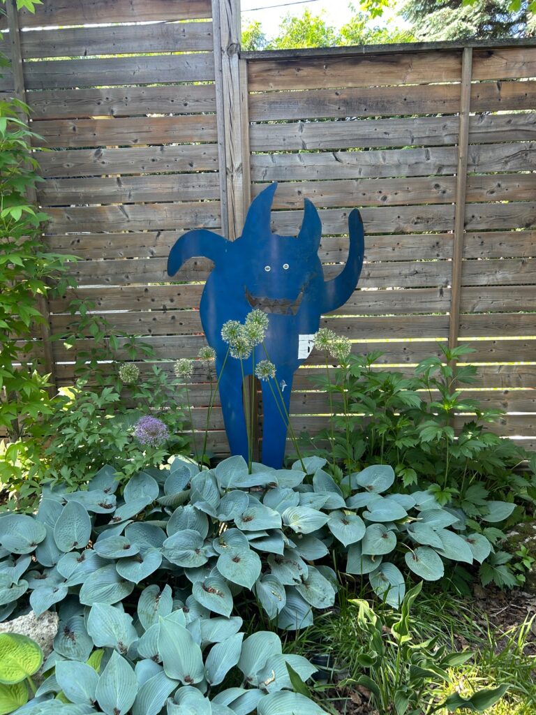 Belgian artist Jean Pierre Schoss blue metal sculpture, Dog Bite Steel